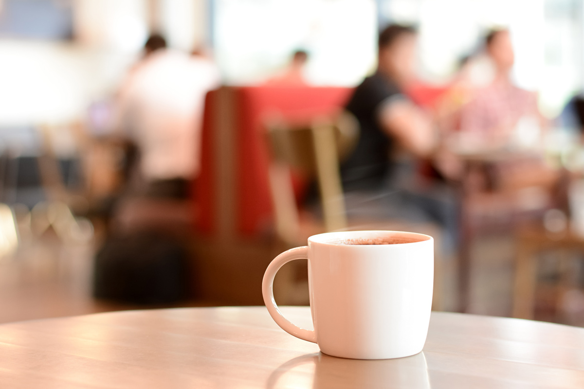 Coffee cup on the table in coffee shop